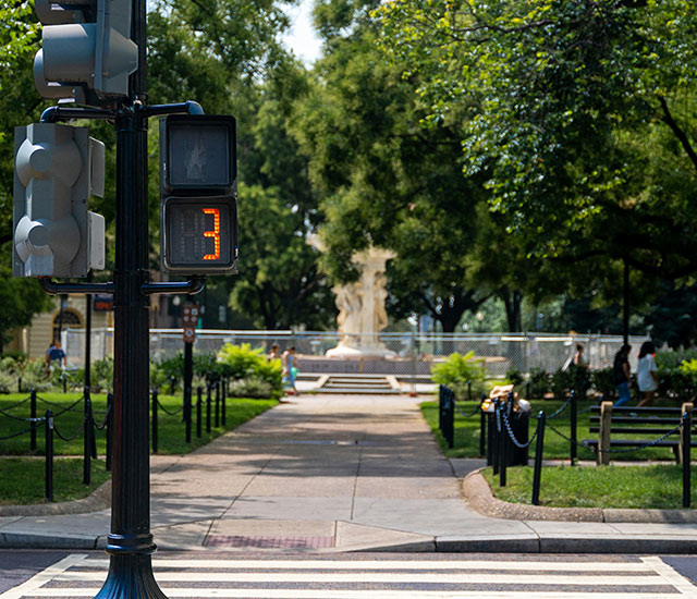 A traffic light, park is near by.